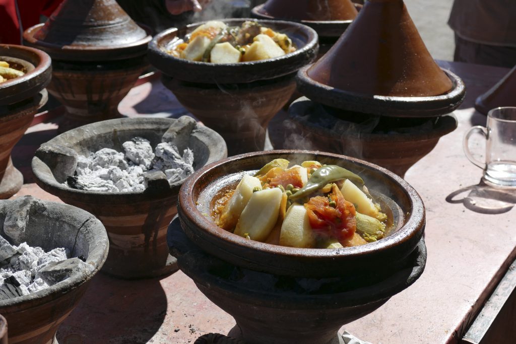 Vegetables steaming in tagine cooking pots in Zaida, Morocco, Africa