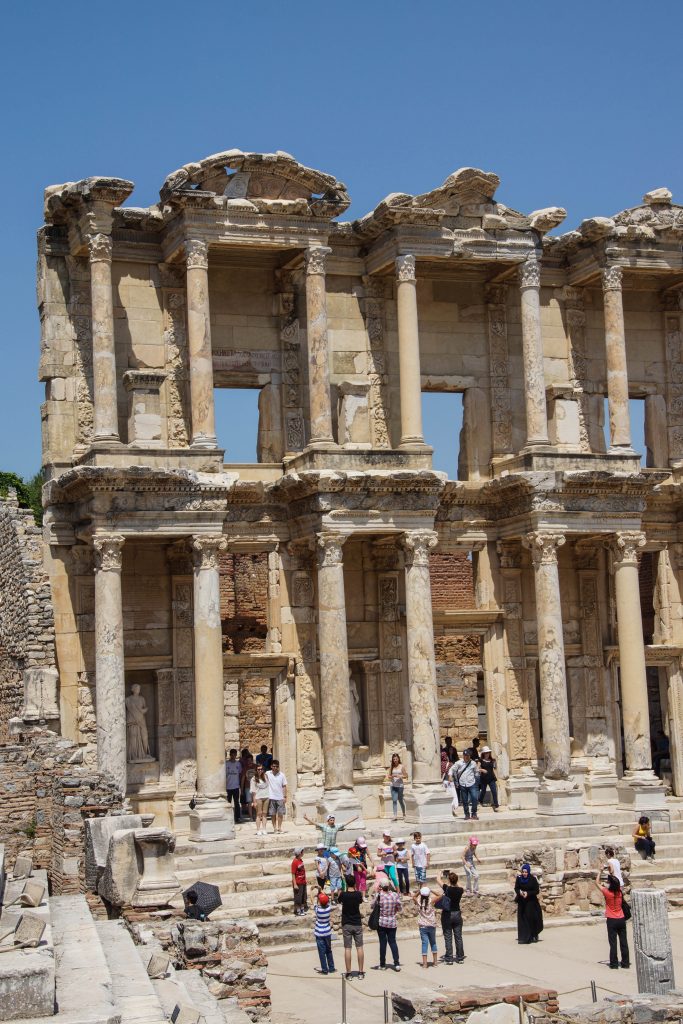 Tourists explore and photograph the Library of Celsus  Ephesus, Turkey